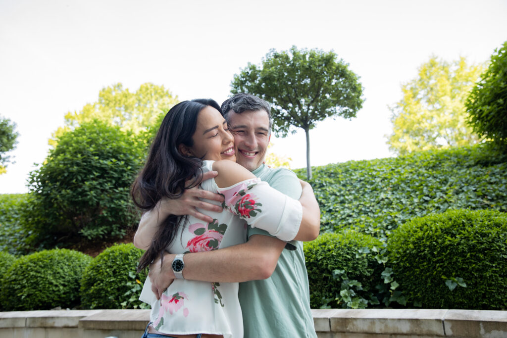 Mature couple give hugs while greeting each other